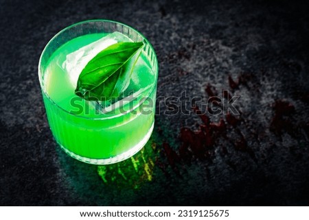 gin basil smash cocktail in glass