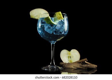 Gin Blue Tonic With Apple And Cinnamon On Black Background