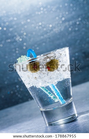 Gin Cocktail with crushed ice and olives