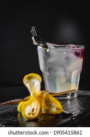 Gin Cocktail With Lemon And Honey On Black Background 