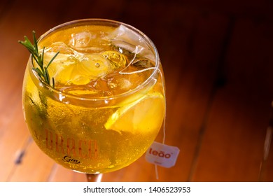 Gin and lemon cocktail on wood background. London Dry Gin, Draco Gin Brand. May, 2019. Ribeirao Preto - Sao Paulo - Brazil