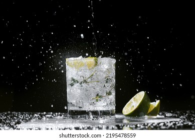 Gin And Tonic With Citrus Fruit And Thyme Pour The Tonic Into A Glass. Cocktail Making Process. Cocktail Splatter