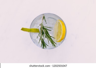 Gin Tonic Cocktail Drink With Green Lime Top View On White Background