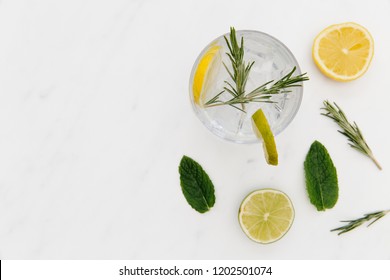 Gin Tonic Cocktail Drink With Green Lime On White Background