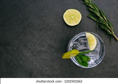 Gin Tonic Cocktail Drink With Ice Glass Green Lime On Dark Background