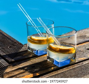 Gin And Tonic Cocktail On Poolside Bar
