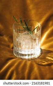 Gin Tonic Cocktail, One Large Ice Cube, Garnished With Rosemary