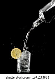 Gin Tonic Cocktail Pouring Isolated On Black Background