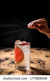 Gin And Tonic Cocktail Recipe, Citrus Oil Expression Shot, Highball Glass, Wooden Table, Dark Background