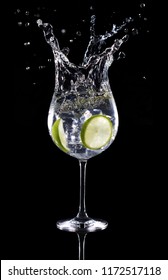 Gin Tonic Cocktail Splashing Isolated On Black Background