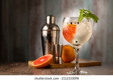 Gin Tonic Garnished With Grapefruit And Mint.