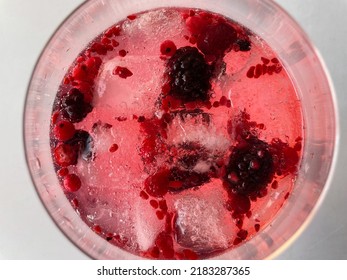 Gin Tonic With Ice And Red Berries Seen From Above