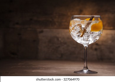 Gin tonic on a wooden background - Shutterstock ID 327064970