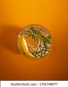 Gin And Tonic Top View On An Orange Background