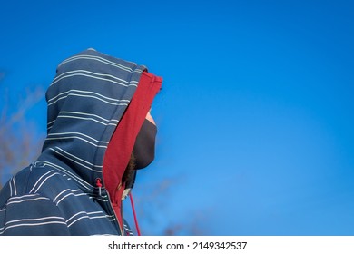 Ginger Bearded Irish Man - Unrecognizable Seen In Profile In A Face Mask And Hooded Sweater