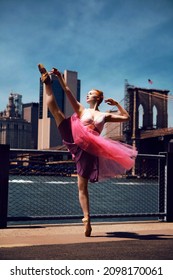 Ginger Beautiful Female Model Dancing Ballet On Street In Front Of Brooklyn Bridge In New York City