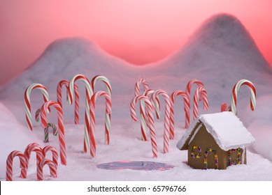 Ginger Bread Cottage Next To A Pond In Candy Cane Forest With Pink Sunset