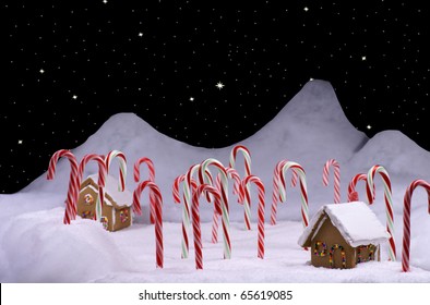 Ginger Bread Cottages In A Snow Covered Candy Cane Forest And A Star Lit Sky