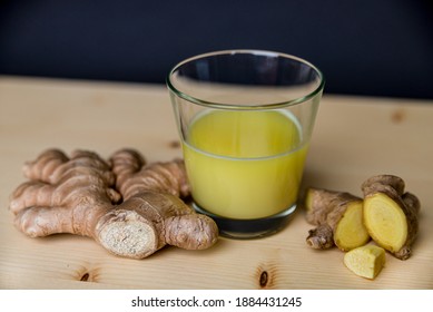 Ginger Juice, With Ginger Root Next To It