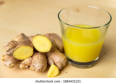 Ginger Juice, With Ginger Root Next To It