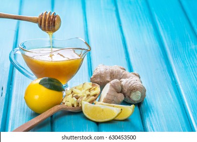 Ginger, lemon and honey bowl on wooden table. Rustic wooden background. - Powered by Shutterstock