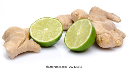 Ginger with a lime cut in half, isolated on white - Powered by Shutterstock