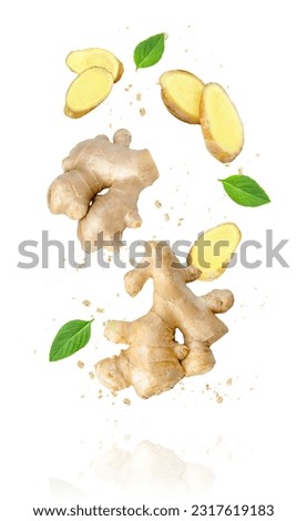 Ginger powder and ginger root with cut sliced levitate isolated on white background.