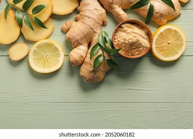 Ginger powder, roots and lemons on color wooden background - Powered by Shutterstock