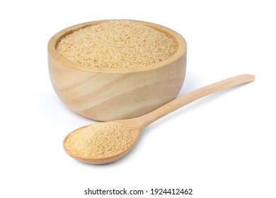 Ginger powder in wooden bowl and spoon isolated on white background. 
