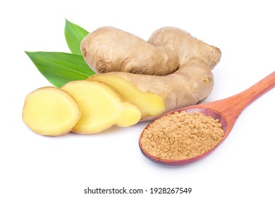 Ginger rhizome slices and green leaves with ginger powder in wooden spoon isolated on white background.