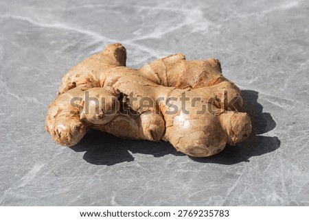 Ginger Root Close-Up on Textured Background