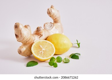 Ginger Root, Mint Leaves And Lemons On A Gray Background, Health Benefits Of Ginger, Natural Drink For Immunity Copy Space