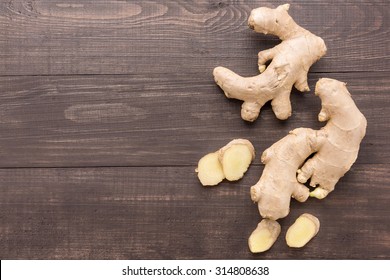 Ginger Root On The Wooden Background. Top View.