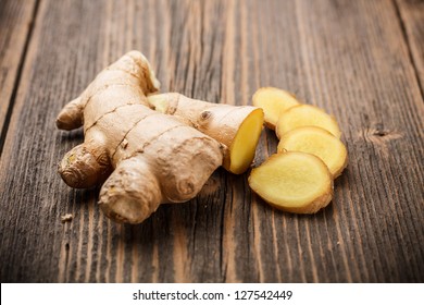 Ginger root sliced on wooden table - Powered by Shutterstock