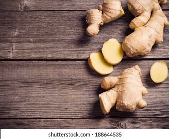 Ginger Root Sliced On Wooden Background