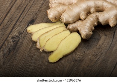 Ginger Root Sliced On The Wooden Table