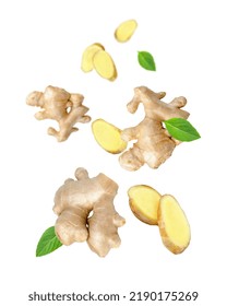 Ginger Spice With Cut Slices And Mint Leaf Flying In The Air Isolated On White Background.