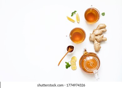 Ginger tea in a glass teapot on a white background. The view from the top - Powered by Shutterstock