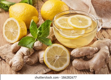 Ginger tea with lemon on a wooden table - Powered by Shutterstock