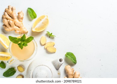 Ginger tea with lemon at white table. - Powered by Shutterstock