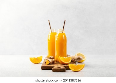 Ginger turmeric shots, healthy healing drink concept