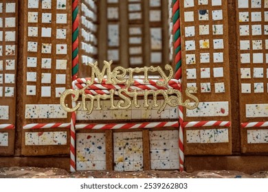 Gingerbread building with “Merry Christmas” Sign in Festive Display - Powered by Shutterstock