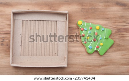 Gingerbread christmas tree on wooden background 