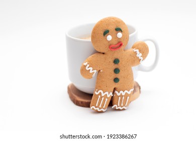 Gingerbread classic decorated cookie with cup of coffee.