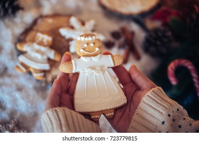Gingerbread Cookie Being Held In the hands