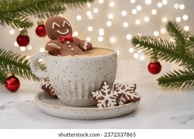 Gingerbread cookie man with a hot chocolate for Christmas. Traditional holiday symbol. Christmas holiday background.