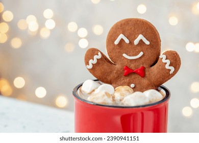 Gingerbread cookie man with a hot chocolate for Christmas. Traditional holiday symbol. Christmas holiday background. - Powered by Shutterstock