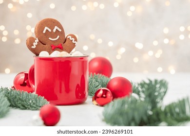 Gingerbread cookie man with a hot chocolate for Christmas. Traditional holiday symbol. Christmas holiday background. - Powered by Shutterstock