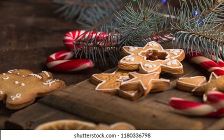 Gingerbread Cookies With Chrismas Decorations On Wooden Table