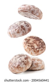 Gingerbread cookies are falling on a heap close-up on a white background. Isolated